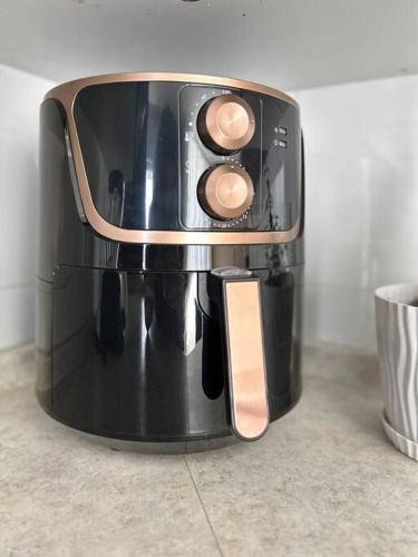 a black coffee maker sitting on top of a counter at Nueva Galicia residencial, es una propiedad completa al sur de la ciudad que te ofrece modernidad, espacio, tranquilidad, cuenta con 4 recamaras 3 baños completos y 2 cajones de estacionamiento privados in Guadalajara