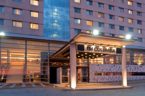 a hotel building with a sign that reads the columbiana at NH Montevideo Columbia in Montevideo