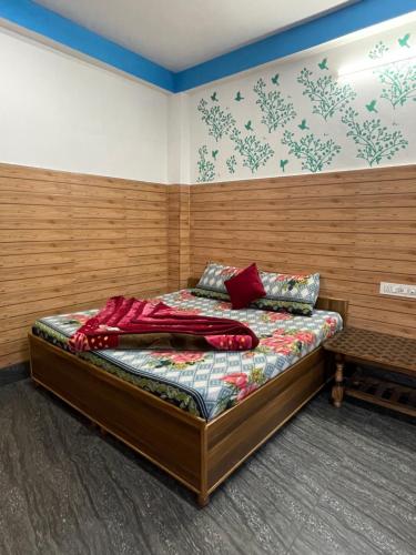 a bedroom with a bed in a room at Chojh Inn Guest House in Kasol