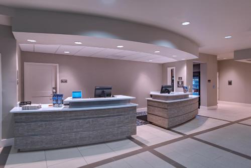 a lobby of a hospital with a reception counter at Residence Inn by Marriott Jackson The District at Eastover in Jackson