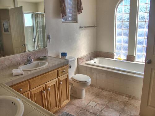 a bathroom with a sink and a toilet and a tub at 555 Lancaster St. in Cambria