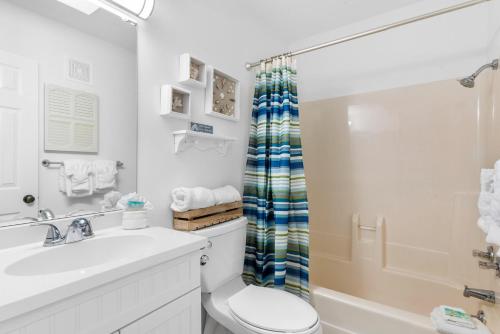 a bathroom with a sink and a toilet and a shower at Gulf Shores Plantation-East 3210 in Gulf Shores