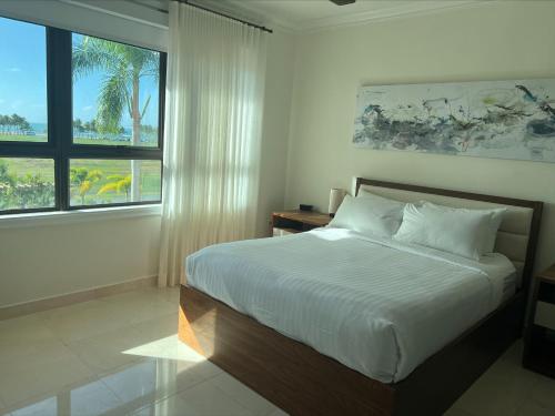Ένα ή περισσότερα κρεβάτια σε δωμάτιο στο The Country Club Residences at Grand Reserve