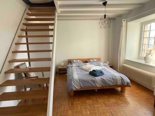 Cama o camas de una habitación en Welcoming house in Chavornay + free parking