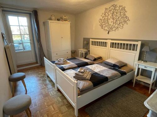 Postel nebo postele na pokoji v ubytování Welcoming house in Chavornay + free parking
