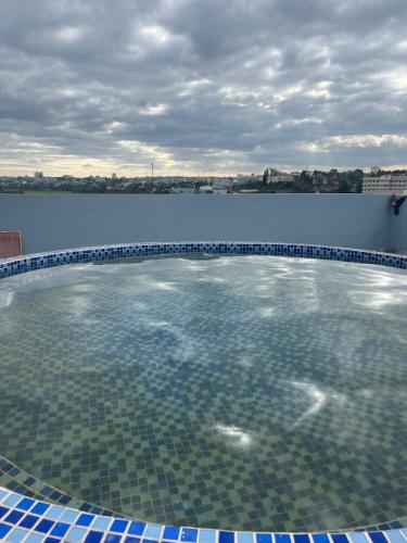 a swimming pool with a view of the water at SAIGON - PLEIKU HOTEL in Pleiku