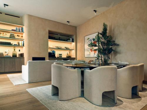 a dining room with a table and chairs at Botanic Sanctuary Antwerp - The Leading Hotels of the World in Antwerp