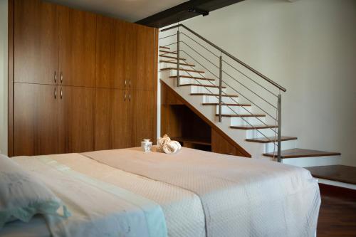 Ένα ή περισσότερα κρεβάτια σε δωμάτιο στο l'Apostolo e il Navarca