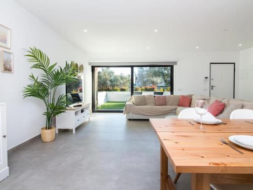 a living room with a couch and a table at Bonjour House by Stay ici in Albufeira