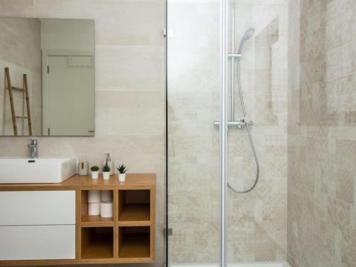 a bathroom with a shower and a sink at Bonjour House by Stay ici in Albufeira