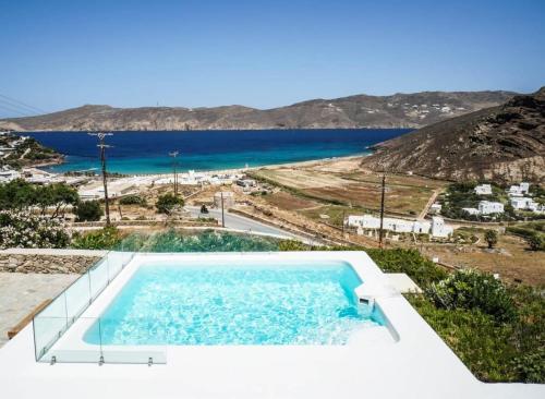 a swimming pool with a view of the ocean at Mykonian Exclusive 3Bd Villa with Private Pool in Mykonos