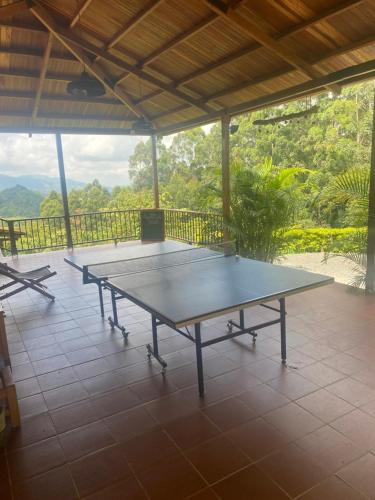 a ping pong table sitting on top of a patio at Ecoresort Gran Azul in Salento