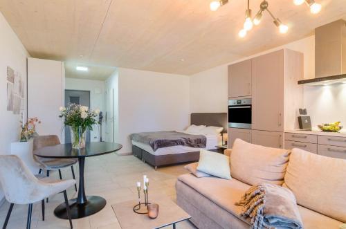 a living room with a couch and a table at Aquamarin in Überlingen