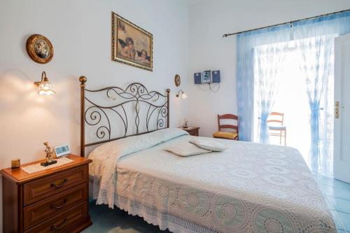 En eller flere senge i et værelse på Divina Costiera Praiano