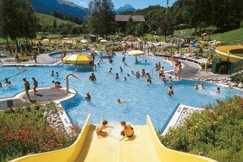 a group of people in a swimming pool at Appartment Scheiber in Leogang