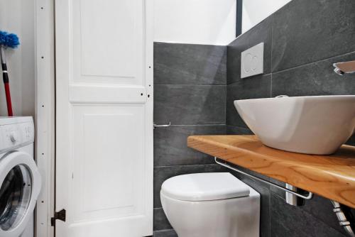 a bathroom with a sink and a toilet at Ca' du Re in Chiavari