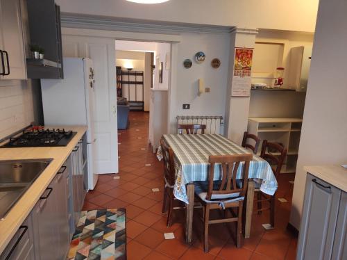 a kitchen with a table and chairs in a kitchen at Da Carlotta in Castel di Sangro