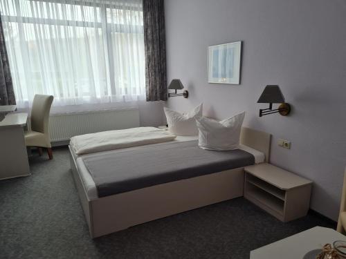 Voodi või voodid majutusasutuse Hotel Stadt Witzenhausen toas