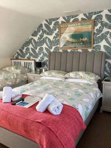 Ένα ή περισσότερα κρεβάτια σε δωμάτιο στο The Alendale Guesthouse