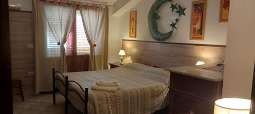 a bedroom with a bed and a sink at B&B Il Girasole in Assemini