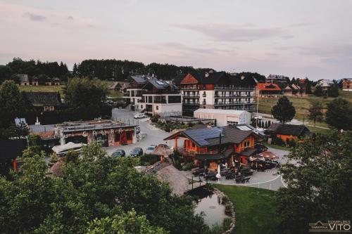 an aerial view of a town with a building at Kompleks Tawerna Vito - Apartamenty Vito in Czorsztyn