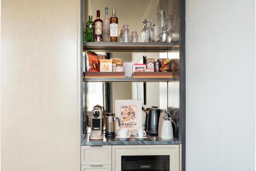 a shelf with a coffee maker on it at Maison Hudson in New York