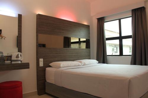 Postel nebo postele na pokoji v ubytování Time Hotel