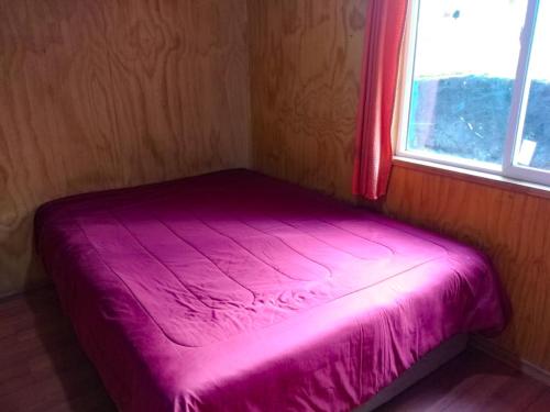 Säng eller sängar i ett rum på Cabaña Roble Endémico
