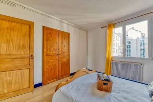 a bedroom with a bed and a large window at La Dolce Vita¶ Belle vue ¶ Confort ¶Proche TRAM in Grenoble