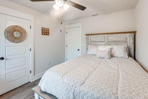 a bedroom with a large bed and a ceiling fan at Near State Parks Carrabelle Home with Beach Access! in Big Blackjack Landing