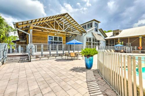 a house with a fence and a patio at Near State Parks Carrabelle Home with Beach Access! in Big Blackjack Landing