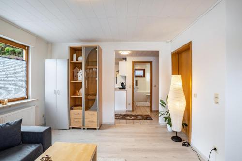 a living room with a couch and a table at Ferienwohnung Brigitte in Forbach