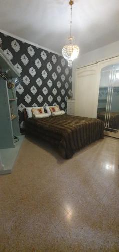 a bedroom with a bed with a black and white wall at VIBE SPOLETO, Stazione a 150 mt, parcheggio gratuito in Spoleto