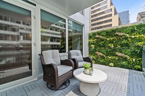 two chairs and a table on a balcony at The Gotham Hotel in New York