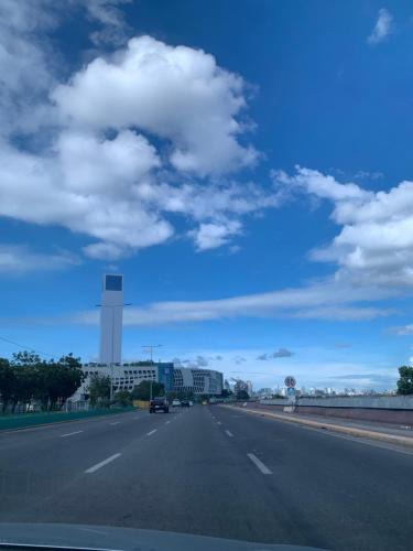 a highway with a car driving down the road at Sanremo Oasis, City de Mare in Cebu City