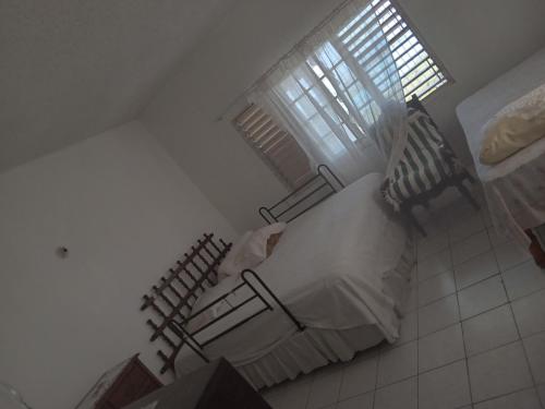 an overhead view of a bedroom with a bed and a window at OCEANView in Montego Bay