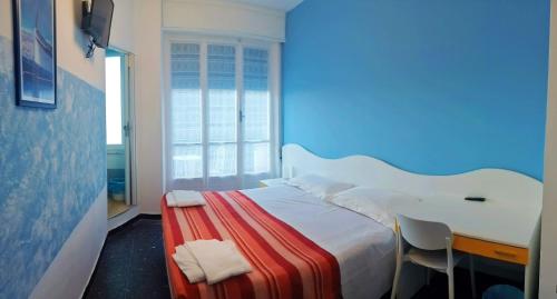 A bed or beds in a room at Albergo Belvedere