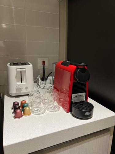 a counter top with a coffee maker and a toaster at 2 bedroom apartment Wabi Sabi in Yas in Abu Dhabi