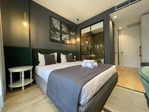 Ένα ή περισσότερα κρεβάτια σε δωμάτιο στο Retreat Apartments