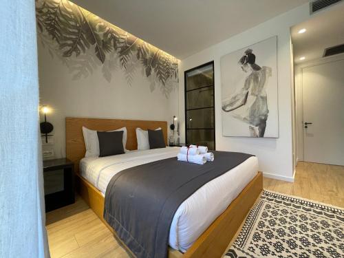 Ένα ή περισσότερα κρεβάτια σε δωμάτιο στο Retreat Apartments