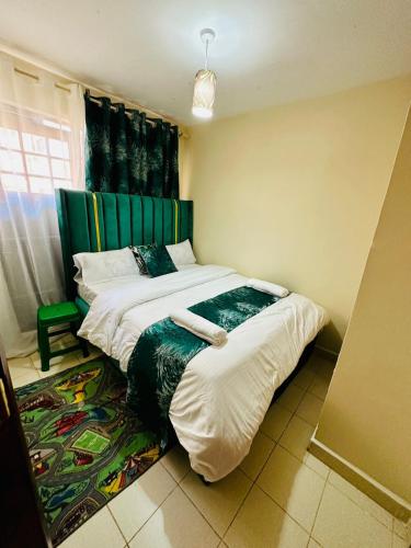1 Schlafzimmer mit 2 Betten in einem Zimmer in der Unterkunft Nuna house in Nairobi