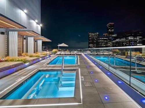 a large swimming pool on the side of a building at Luxury 1 Bedroom 1Bath Convention Center in Seattle