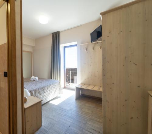 Postel nebo postele na pokoji v ubytování Rifugio Sapienza