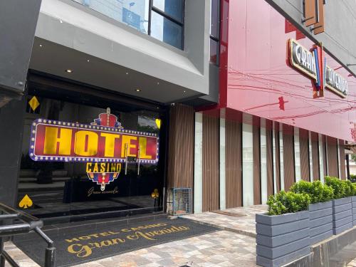 a hotel sign in the window of a building at Hotel Casino GRAN AVENIDA in Barrancabermeja