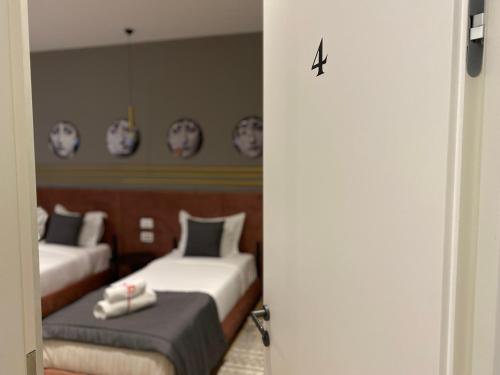 Ένα ή περισσότερα κρεβάτια σε δωμάτιο στο Retreat Apartments