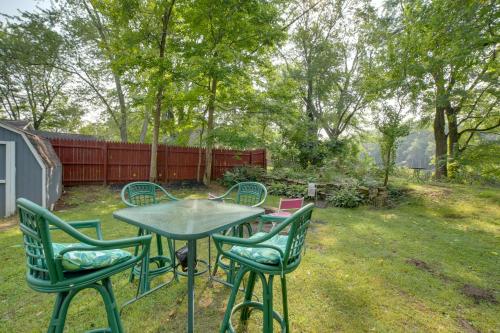 a table and four chairs in a yard at Riverside Niles Retreat with Fire Pit and Grill! in Niles