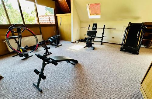 a gym with several exercise equipment in a room at Descanso urbano in Santiago