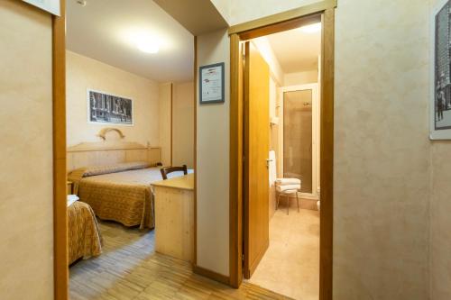 Postel nebo postele na pokoji v ubytování Rifugio Sapienza