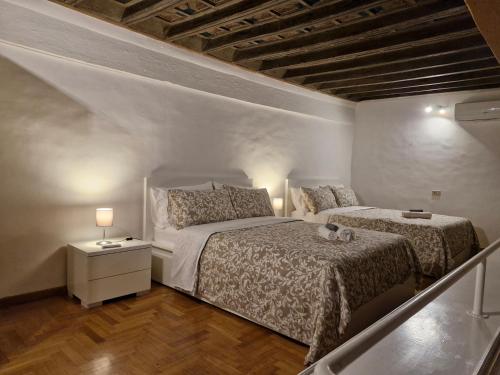 Posteľ alebo postele v izbe v ubytovaní Coronari 45 apartment