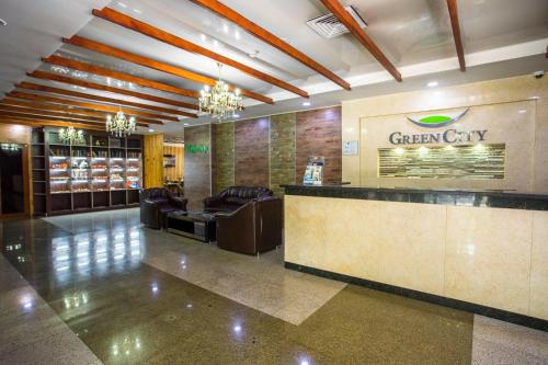 a large lobby with a green city sign on the wall at Апартаменты у моря - в "Green City RESORT" in Baku